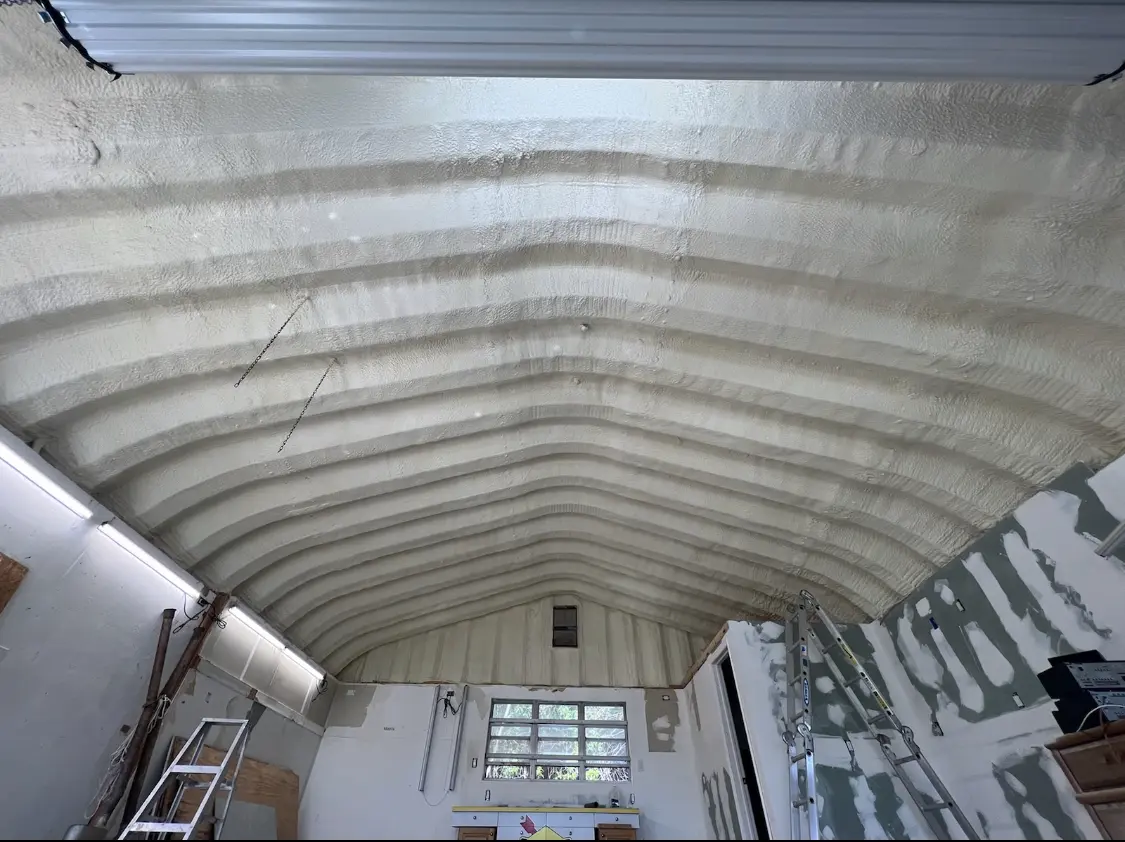 Spray polyurethane foam applied to the underside of a metal roof deck in Dalhart